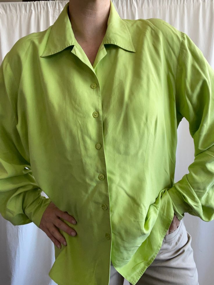 Lime green oversize shirt from 100 % silk . Labeled ad size D 44, F 46. Would fit from M oversize to XL . Chest 120 cm, length 68 cm, shoulders 45 cm . Perfect condition Green Silk Button-up Blouse, Summer Oversized Silk Blouse, Chic Silk Top With Collared Neckline, Chic Solid Color Collared Shirt, Chic Solid Collared Shirt, Trendy Solid Button-up Tops, Elegant Oversized Tops With Spread Collar, Oversized Spring Workwear Shirt, Elegant Green Shirt For Spring