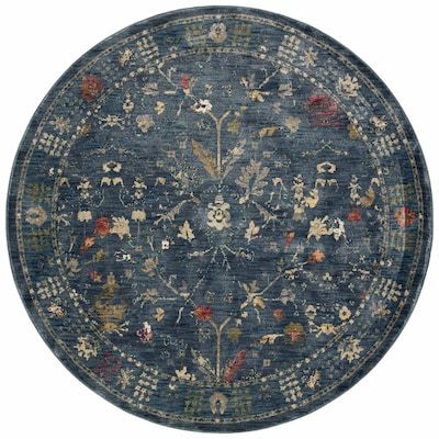 a round blue rug with flowers and leaves on the center, in an ornate pattern