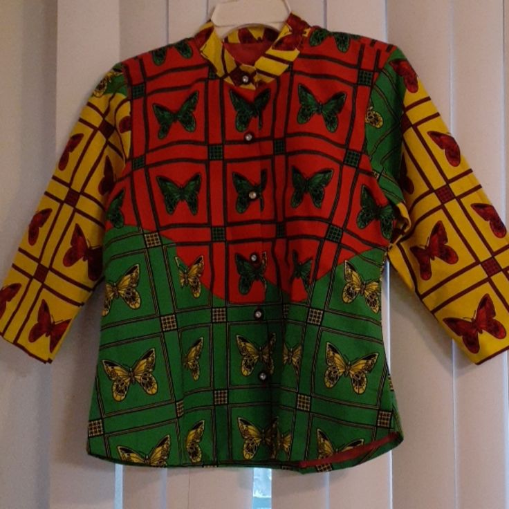 Beautiful Multicolor African Button Up Butterfly Print Blouse. 3/4 Sleeves Can Be Worn Up Or Down Handmade Yellow Long Sleeve Shirt With Patchwork, Spring Yellow Patchwork Shirt, Fitted Half Sleeve Tops With Buttons, Yellow Short Sleeve Blouse With Patchwork, Multicolor Half-sleeve Blouse For Fall, Green Top With 3/4 Sleeves And Button Closure, Multicolor Cotton Blouse With Buttons, Casual Yellow Patchwork Blouse, Yellow Fitted Shirt For Fall