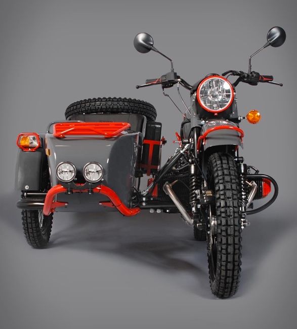 an orange and black motorcycle with a side car