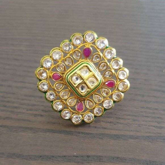 Bollywood designer kundan  ring  with gold plating are beautiful, elegent & will surely galvanize you, Adjustable Finger ring this Gold kundan ring looks beautiful  and elegant perfect for all occasion on any outfits you choose to wear (saree, salwar suits, lenga, etc.) *High quality craftsmanship 100% satisfaction guarantee  *Plated in Gold plating *adjustable finger ring *base metal for ring is copper *package include polki kundan ring *ready to ship from Houston TX United States GIFT- It comes in gift box perfect for gifting to your mom , sister, in laws, friends, on there birthday, wedding , bridal shower, anniversary, festival , and many more... Discover a variety of Necklace sets and Earring  only at Azzashiny.fj . our product are made from metal & alloys like Copper or Brass respect Gold Kundan Toe Ring, Gold Kundan Rings In Temple Jewelry Style, Festive Gold Kundan Ring, Gold Ring With Stone Work, Elegant Gold Kundan Rings, Elegant Kundan Rings For Festive Occasions, Elegant Kundan Rings For Festive Season, Festive Gold Rings With Stone Setting, Diwali Gift Toe Ring Jewelry