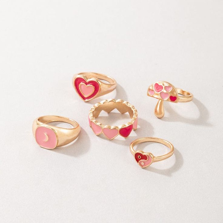 Description:Pink Chic 5 Pieces Heart Ring SetSpecifications:Material: copper, enamel, 18k goldColor: goldSize: #8 - #9Weight: 22 g/set Fall in love with Pink Chic's 5-piece heart ring set! Mix and match these playful rings to add a quirky touch to any outfit. With a variety of heart sizes and styles, this set is perfect for expressing your unique style. 💗 Moving Butterfly, Butterfly Rings, Rings Dainty, Jewelry Wishlist, Mushroom Ring, Wife Jewelry, Heart Band, Valentine Gifts For Girlfriend, Adjustable Jewelry