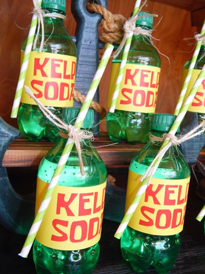 there are two bottles that have kel sod on them and one is filled with candy