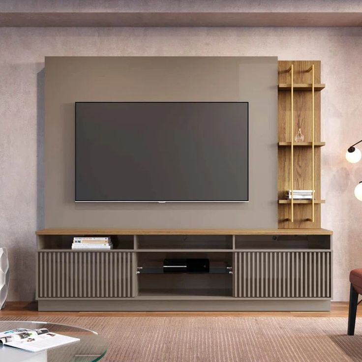 a large flat screen tv mounted to the side of a wall in a living room