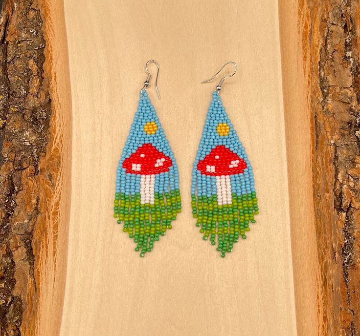 Mushroom Beaded Earrings with Fish Hook Backs. Color Beads : Multi-Color  Length : 3.6 inches Whimsical Adjustable Beaded Earrings, Whimsical Handmade Beaded Dangle Earrings, Whimsical Adjustable Beaded Dangle Earrings, Bohemian Dangle Earrings With Mushroom Design, Adjustable Dangle Beaded Earrings With Bead Caps, Indigenous Earrings, Native Earrings, Mushroom Earrings, Earrings Indian