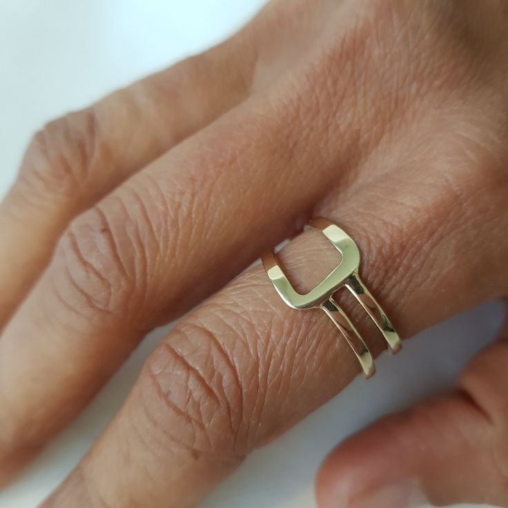 14K solid gold ring in a minimalist style for lovers of geometric shapes. ◈ DETAILS Weight: 3g Width upper part-9mm / 0.35'' Thickness-1.3 mm / 0.05'' ◈ MATERIAL 14K Solid Gold - Smooth,shiny,plain surface ◈ ALSO AVAILABLE IN 14K/18K/9K Yellow, Rose, or White Gold ◈ ENGRAVING is optional ◈ SHIPPING is insured express and free worldwide ◈ GIFT WRAPPING is included with every purchase ✧ Back to my shop for more handcrafted gold jewelry: https://etsy.me/38Cs5Zl If you have any questions, I will be Modern Everyday Stackable Rings With Open Band, Minimalist Recycled Gold Stackable Toe Rings, Minimalist Recycled Gold Open Band Ring, Modern Gold Stackable Initial Ring, Minimalist Stackable Rings With Open Band In Recycled Gold, Modern Stackable Rings As A Gift, Modern Stackable Rings As Gift, Modern Stackable Toe Rings For Gifts, Modern Stackable Rings