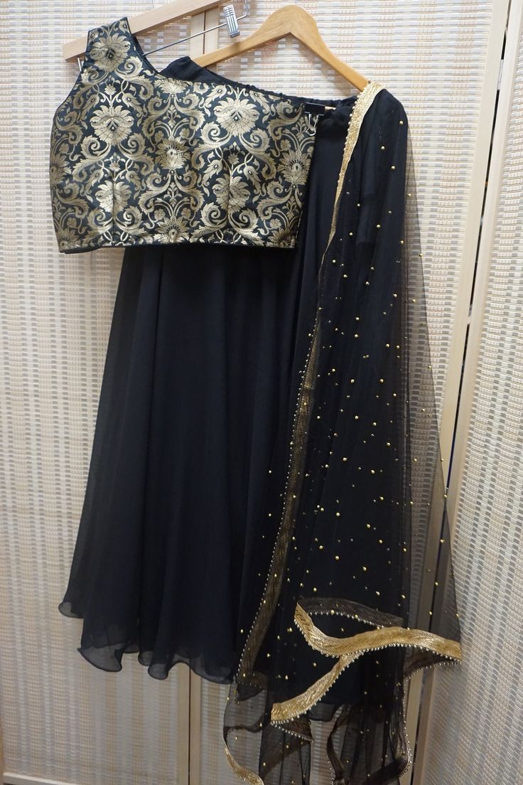 *Ready made 3 piece set  *Material: Brocade blouse, georgette skirt, net dupatta - blouse is high quality Banarasi Silk  *Design is gold floral  *Halter neck style  *Size Bust: 36 inches and 38 inches available - please message us for customization options! *Color may vary slightly from picture  *Our store is located in Los Angeles & in store pick up is welcome. Gold Salwar Kameez For Party, Festive Gold Georgette Sets, Gold Chinon Salwar Kameez For Party Wear, Party Wear Salwar Kameez In Gold With Zari Work, Georgette Choli For Eid Celebration, Gold Floor-length Salwar Kameez For Party, Designer Gold Georgette Sharara, Gold Salwar Kameez With Zari Work For Party, Festive Gold Georgette Sharara