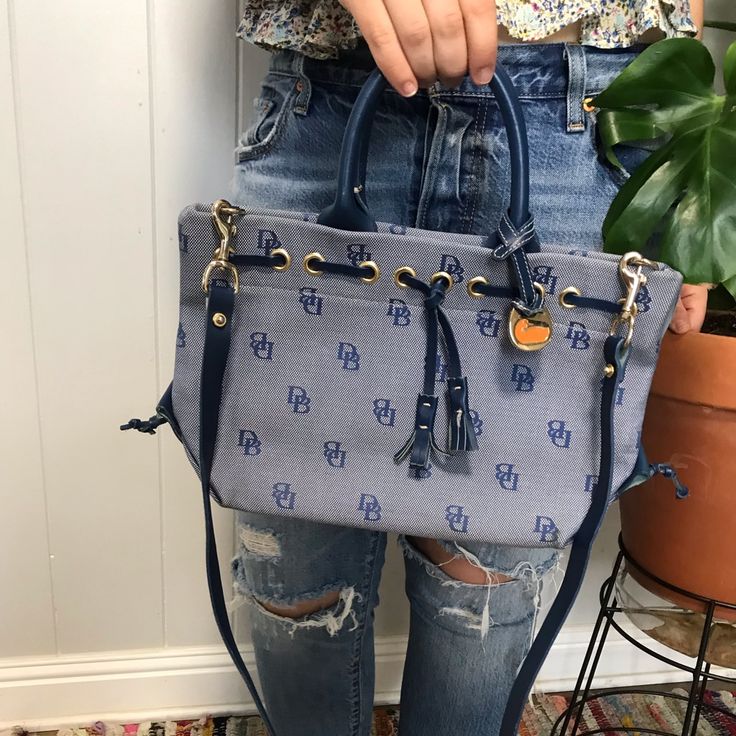 Classic Dooney And Bourke Handbag With Logo. Blue And Navy Blue. Brand New Condition. Casual Blue Top Handle Bucket Bag, Blue Crossbody Bag With Dust Bag Included, Blue Designer Satchel Shoulder Bag With Dust Bag, Blue Designer Satchel With Dust Bag, Casual Blue Satchel With Detachable Handle, Blue Leather Handle Bucket Bag, Blue Satchel Bucket Bag With Dust Bag, Navy Tote Bag With Detachable Handle, Blue Bucket Bag With Detachable Handle For Everyday Use