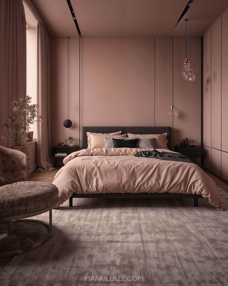 a bedroom with pink walls and furniture in the corner, along with a large bed