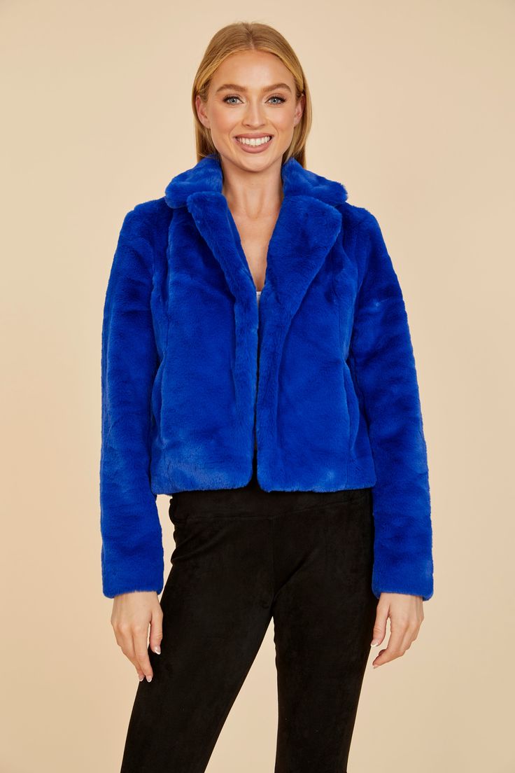 Our Plush Faux Fur Notch Collar Jacket is the epitome of comfort meets style. With its notched collar and open front, this short faux fur jacket exudes an effortlessly chic and relaxed aura. Its sumptuous faux fur promises plenty of warmth, plus it comes in a variety of trendy colors, making it an ideal choice for both fashion-forward moments and cozy evenings. Faux fur Notched collar Comes in Ivory, Blush, Green, Black, Bisque, Pink, Red, and Blue Dry clean Item # 75362 Chic Blue Fur Coat, Blue Fur Jacket, Short Faux Fur Jacket, Collar Jacket, Notch Collar, Notched Collar, Faux Fur Jacket, Trendy Colors, Cool Suits