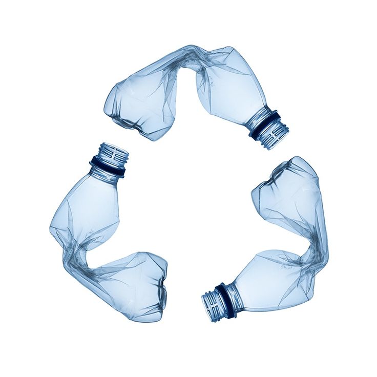 three empty water bottles in the shape of a circle