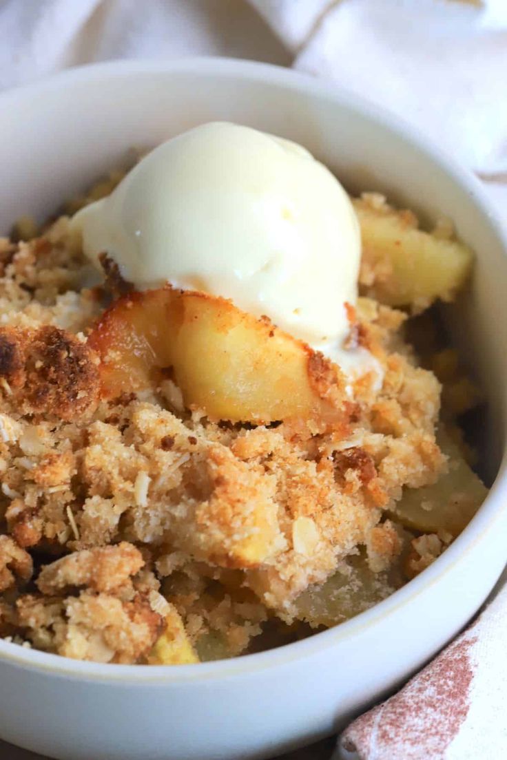 a close up of a bowl of food with ice cream