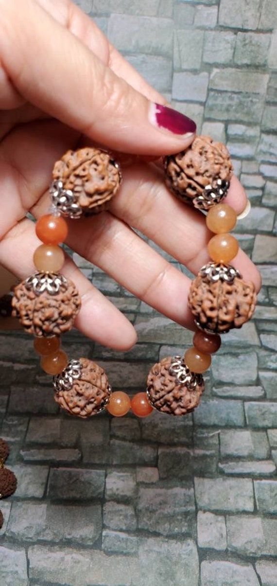 Rudraksha is like eight mountains and has power of mountains and has power of mountains. Rudraksha word is related to Hindu Religion. Rudraksha tree and seed both are called Rudraksha. In Sanskrit Rudraksham means Rudraksha fruit as well as Rudraksha tree. Rudraksha tree grows on mountains and hilly region of Nepal, Indonesia, Java, Sumatra and Burma. Its leaves are green in colour and the fruits are brown in color and sour in taste. The Rudraksha fruits also adorn the human beings because of spiritual values.  Benefits of Wearing Rudraksha: It mitigates the past reactions of karmas. It protects you against ominous accidents and unfortunate events. It cures the influence of adverse planets and black magic. It regulates blood pressure. It minimizes stress and cools down the mind. It reduces 5 Mukhi Rudraksha, August Moon, Rudraksha Bracelet, Spiritual Values, Rudraksha Beads, Unfortunate Events, Black Magic, Blood Pressure, Nepal