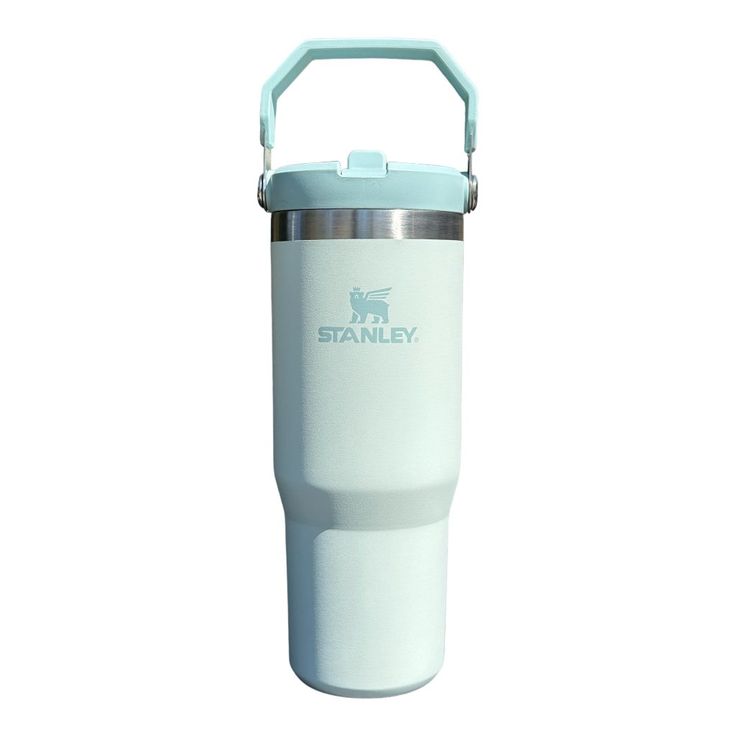 a white and blue insulated travel mug with the words stanley on it's side