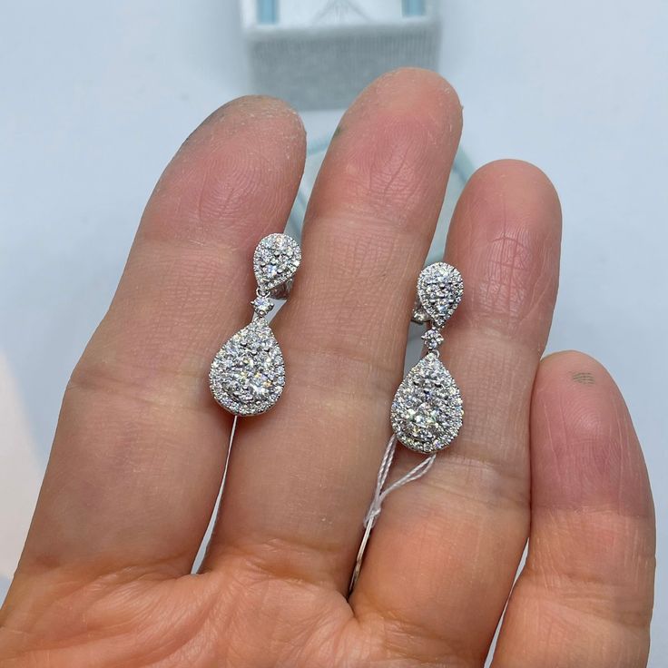 Gorgeous Pear Cut Diamond Dangling Earrings White Gold. Excellent craftsmanship, the diamonds are clean and very sparkling. This design is timeless and classy. The large push backs have double notches for a secure fit. Measures 24 x 9mm. Genuine Round Brilliant Cut Diamonds Total Weight: 1.74 Carats Clarity: VS/SI Color: G All white and shiny diamonds, no cloudy or yellowish stones Solid 18K White Gold Comes with gift box * We have been in the wholesale Jewelry business for over 30 years serving Pear-shaped Diamond Earrings For Formal Events, Platinum Teardrop Diamond Cut Earrings, Platinum Pear-shaped Diamond Earrings With Accents, Teardrop Platinum Diamond Earrings With Prong Setting, Diamond White Pear-shaped Platinum Earrings, Luxury Pear-shaped Cluster Earrings With Brilliant Cut, White Gold Pear-shaped Diamond Earrings For Formal Events, White Gold Pear-shaped Diamond Earrings For Formal Occasions, Pear-shaped Diamond White Earrings In Platinum