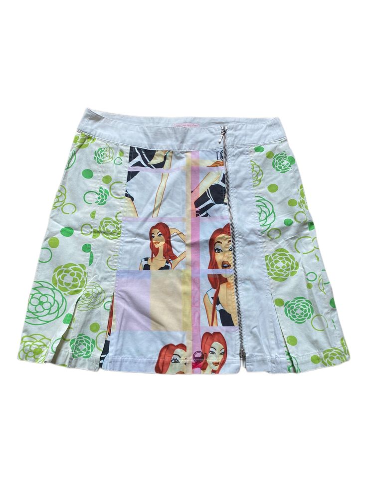 A beautiful vintage Custo Barcelona y2k mini skirt. Featuring a beautiful design of a model and green flowers set on a white backdrop. There is a full length zip on the front of the skirt. 100% cotton. The perfect skirt to wear this spring/summer Measurements: The length is 49cm and the waist is 83cm. Size 12 uk.  Condition: In excellent vintage condition. There are no stains, rips, marks etc.. Please look at all the photos as they are a true representative of this amazing skirt  Feel free to as Y2k Cotton Skort For Spring, Y2k Style Lined Skort For Spring, Y2k Style White Mini Skirt For Spring, Y2k White Mini Skirt For Spring, White Fitted Y2k Skort, Green Y2k Mini Skirt, Y2k Style Short Skort For Spring, Y2k Style Green Mini Skirt For Summer, Green Y2k Style Summer Skirt