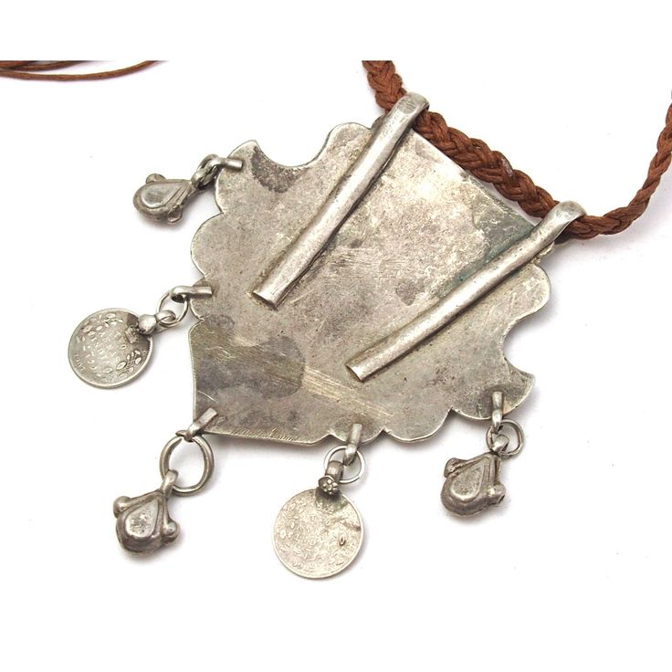 Silver Afghan Dowry Amulet Amulet features a beautiful chased design of a Peahen capturing a Fish, with Emperor Edward VII coin pendants Measures approx. 3 3/4" x 2 3/4", cord length is 30" 80% silver by weight. Origin is Afghanistan, early 20th C. Traditional Adjustable Cord Festival Jewelry, Engraved Amulet Medallion Necklace, Engraved Coin-shaped Amulet Jewelry, Adjustable Amulet Style Medallion Necklace, Traditional Necklace With Coin Pendant, Collectible Etched Amulet Jewelry, Traditional Coin Necklaces As Collectibles, Traditional Medallion Necklace With Coin Pendant, Traditional Coin Necklaces For Collectors