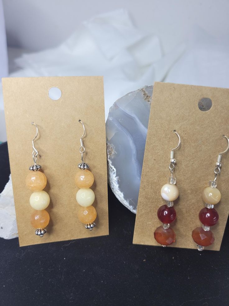 Beautiful handmade earring set of 2 gift one and keep one. These are made with real orange facited turmaline beads and natural agate and glass beads. These have silver 925 earrings hooks Adjustable Beaded Earrings With Natural Stones, Adjustable Beaded Earrings With Natural Stones For Gift, Adjustable Carnelian Earrings With Natural Stones, Amber Carnelian Earrings With Ear Wire, Handmade Amber Beaded Round Earrings, Handmade Amber Round Bead Earrings, Handmade Adjustable Amber Earrings, Agate Earrings With Natural Stones In Round Beads Shape, Handmade Amber Earrings With Round Beads