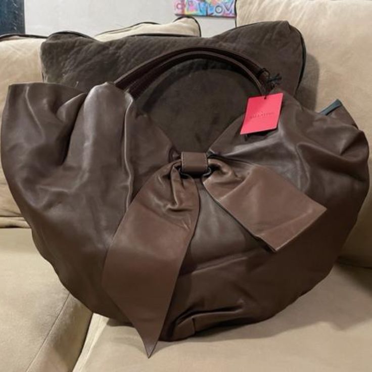 Listed Price Is As Low As I Can Go. No Lower Offers, Please. Super-Soft And Slouchy Chocolate Brown Leather Bow Detail On Front Magnetic Closure Silky Black Lining Interior Slip And Zipper Pockets Dustbag Included Valentino Garavani Bag, Bow Bag, Leather Bow, Leather Bows, Bow Detail, Magnetic Closure, Chocolate Brown, Valentino Garavani, Zipper Pocket