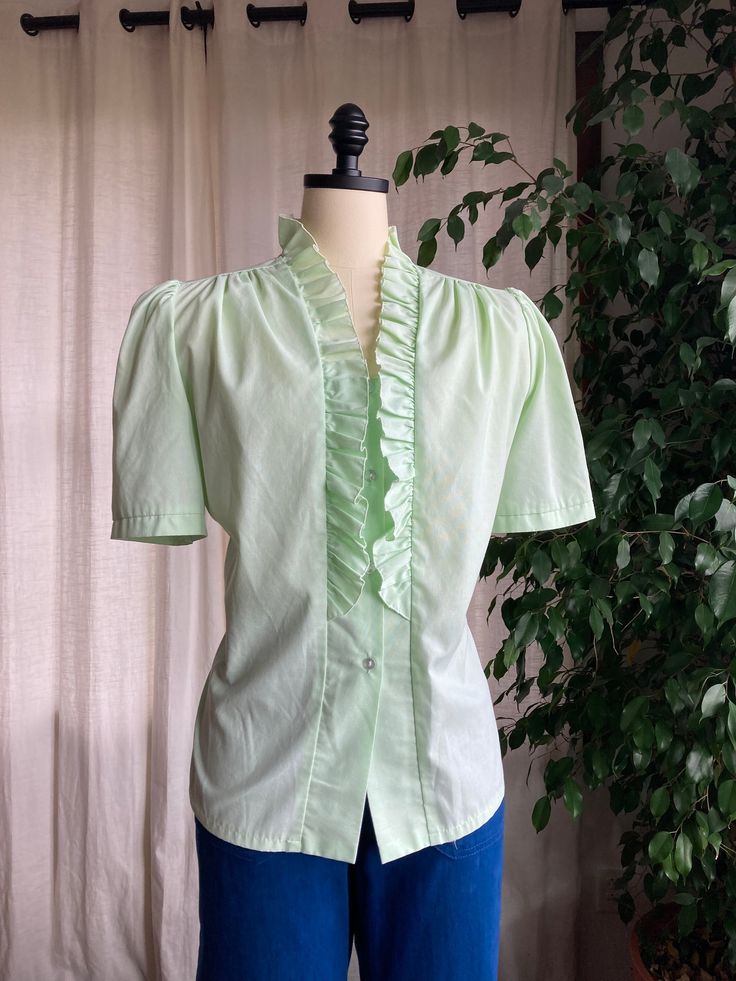 1970's Lime Green Puff Sleeved Ruffled   Blouse. plastic buttons. Made of cotton. Item condition-  this blouse is in fantastic structural condition. no stains or rips. light snagging.  Estimated Size and exact measurements -  Size medium/ large - large  shoulders - 16 across (32) Bust - 23.5 across (47) Waist - 22  across (44) Length -  25 shoulder to hem  Before purchasing. If you would like any more information or photos, please send a message and I would be happy to answer! Item is shipped fully insured with tracking through USPS priority shipping. Item will be shipped with 3 days of purchasing. Ruffled Blouse, Womens Clothing Tops, Lime Green, Puff Sleeve, 1970s, Blouses For Women, Ruffle Blouse, Tops & Tees, Size Medium