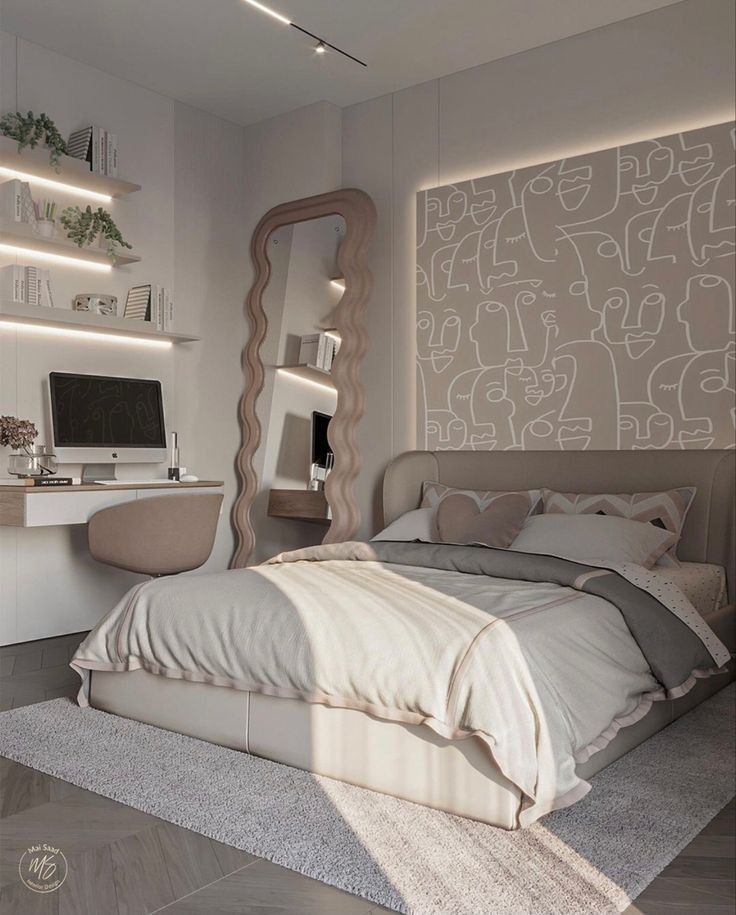 a bedroom with a bed, desk and computer on the wall in front of it