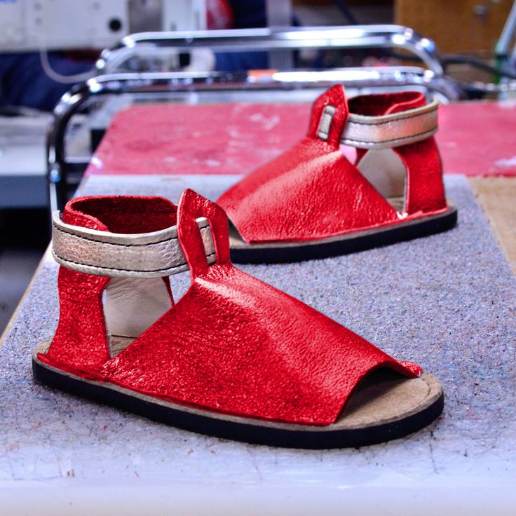 Custom Shoe of the Week: Laguna Sandals in Shiny Ruby with Shiny Platinum Straps. Handcrafted in Oregon, USA. Red Sandals For Spring Outdoor Use, Red Sandals For Spring Outdoor Activities, Red Sandals For Outdoor Spring Use, Red Sandals For Outdoor Spring Activities, Red Outdoor Sandals For Spring, Leather Sandals With Rubber Sole For Outdoor Activities, Red Round Toe Sandals For Outdoor, Leather Closed Toe Sandals For Outdoor Activities, Adjustable Sandals With Rubber Sole For Festival