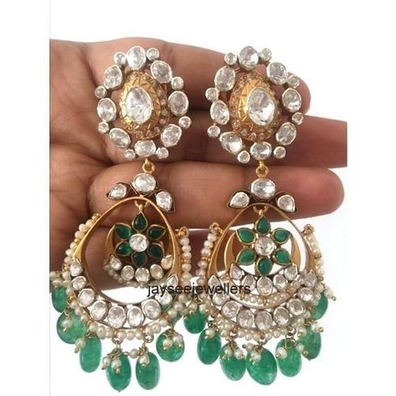 Item-SilverBrand : Jaysee JewellersCountry/Region of Manufacture: IndiaMetal Purity: 925 parts per 1000Main Stone Color - whiteMain Stone :Polki DiamondSecondary Stone :Emerald, Beriyal EmeraldGross Weight - 25.00 Gram Length : 70 mmWidth : 26 mmPolki Diamond & Ruby Gemstone Dangle Earrings, Silver Jewelry.Special customize for Mother's day, Anniversary, Birthday Gift, Valentine, Christmas. Emerald Diamond Earrings, Polki Jewellery, Victorian Rings, Ladies Diamond Rings, Small Earrings, Natural Emerald, Emerald Diamond, Bridal Earrings, Silver Band