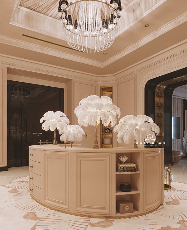 an elegant room with chandelier and large vases on the table in front of it