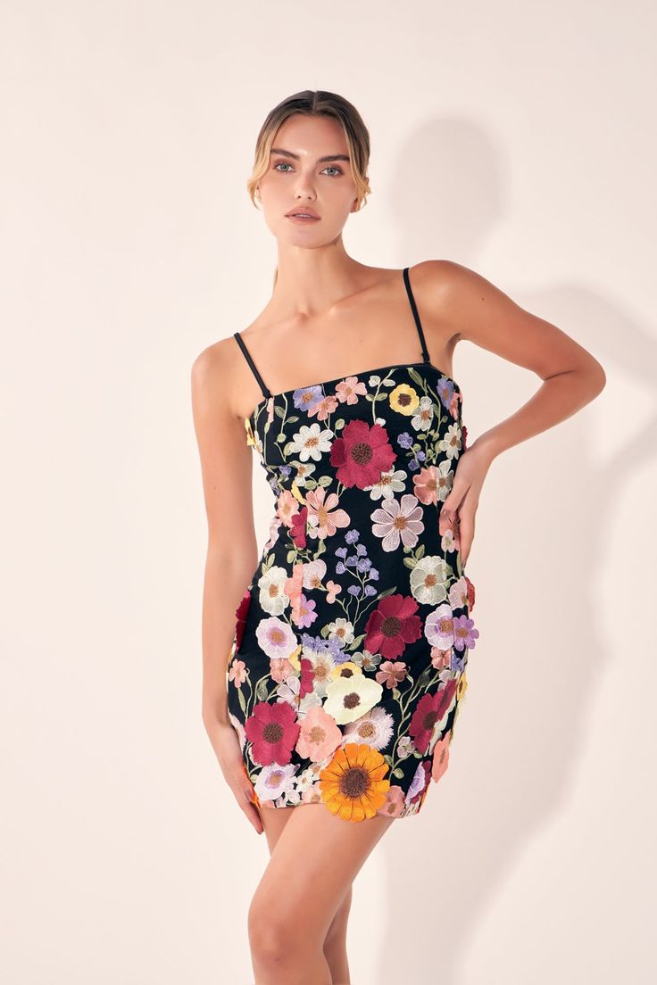 This stunning Floral Embroidered Mini Dress is perfect for any special occasion! With beautiful floral embroidery and a perfectly fitted silhouette this dress is sure to turn heads. The mini length creates a timeless and versatile look ensuring that you stand out from the crowd. Crafted from quality fabrics for a luxurious feel this dress is sure to make you feel comfortable and stylish. Make sure you stand out from the crowd with this luxury Floral Embroidered Mini Dress. Floral Embroidery Fitt Elegant Cocktail Mini Dress With Floral Applique, Elegant Floral Applique Mini Dress For Cocktail, Formal Fitted Dress With Floral Applique, Fitted Dress With Floral Applique, Embroidered Evening Dress For Summer, Elegant Mini Dress With Floral Applique, Elegant Floral Applique Mini Dress, Elegant Mini Length Dress With Floral Applique, Elegant Fitted Dress With Floral Applique