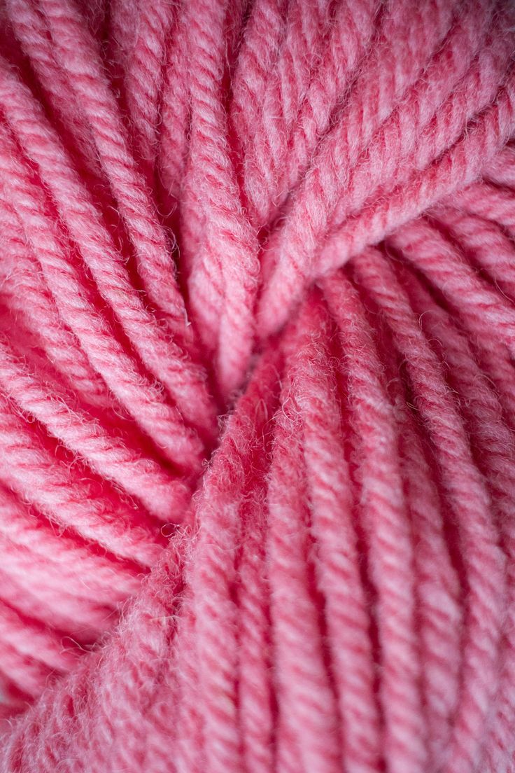 pink yarn is shown in this close up photo