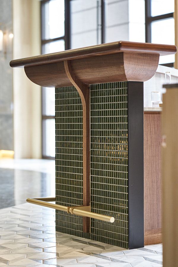 a wooden podium sitting on top of a tiled floor