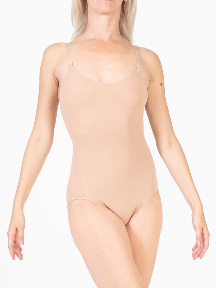 A must-have in any performer's closet. This body liner features customizable clear straps with multiple points of attachment, so you can get the perfect fit and silhouette every time. This simple single layered microfiber leo, is awesome under dresses, or any other leotard that might have come without a lining. Features -full coverage single layer leotard -clear adjustable and customizable shoulder straps -multiple back strap attachment points -mesh crotch lining. Additional Info Body Wrappers® Micro-elastic Full Coverage Bodysuit With Built-in Bra, Fitted Camisole Leotard With Built-in Bra, Fitted Full Coverage Seamless Leotard, Seamless Full Coverage Fitted Leotard, Seamless Fitted Full Coverage Leotard, Full Coverage Nylon Bodysuit With Built-in Bra, Elegant Stretch Bodysuit With Straps, Stretch Nylon Leotard With Moderate Back Coverage, Nylon Shapewear Leotard With Built-in Bra