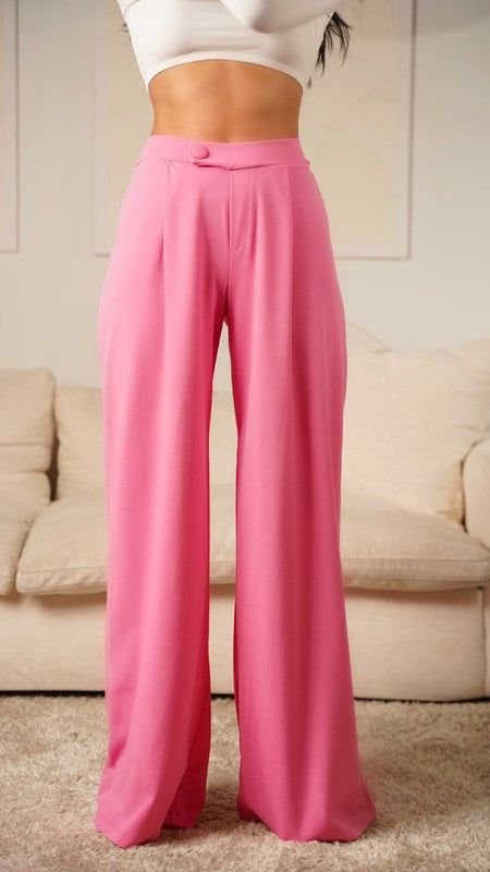 Make a statement in these pink asymmetrical high-waisted trouser pants. These modern-style dress pants feature an asymmetrical cut for a unique look. Crafted from high quality material, these pants are designed to offer both comfort and style. Elevate any outfit with these distinctive trousers. Fabric & fit: 96% POLYESTER 4% SPANDEX Model is wearing size Small. Pink Wide Leg Pants For Loungewear, Pink Wide Leg Loungewear Pants, Chic Pink Loungewear Pants, Pink Long Pants With Solid Color, Pink High-waisted Wide Leg Summer Pants, Pink High Waist Non-stretch Pants, Chic Pink Wide Leg Loungewear Pants, Trendy Pink Wide Leg Pants For Loungewear, Non-stretch High Waist Pink Pants