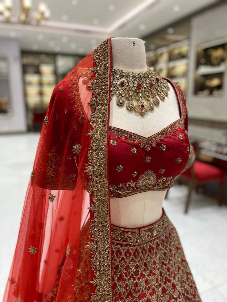 Elevate your wedding look with our Maroon Bridal Lehenga BL-104. This luxurious piece combines maroon and intricate gold embroidery, evoking a sense of regal beauty. The high-quality fabric and handcrafted details make for a truly exquisite and timeless ensemble. Make a statement on your special day with our Lehenga. Fabric: Raw Silk! WASH CARE INSTRUCTIONS - Please Dry clean only when it is applicable! Ready to Ship! Maroon Bridal Lehenga, Lengha Blouse, Lengha Blouse Designs, Maroon Lehenga, Lehenga Fabric, Choli Blouse, Maroon Blouse, Lehenga Blouse, Wedding Look