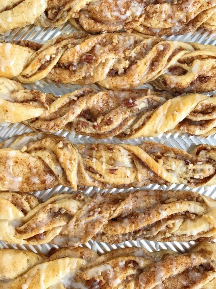 freshly baked pastries are lined up on a cooling rack