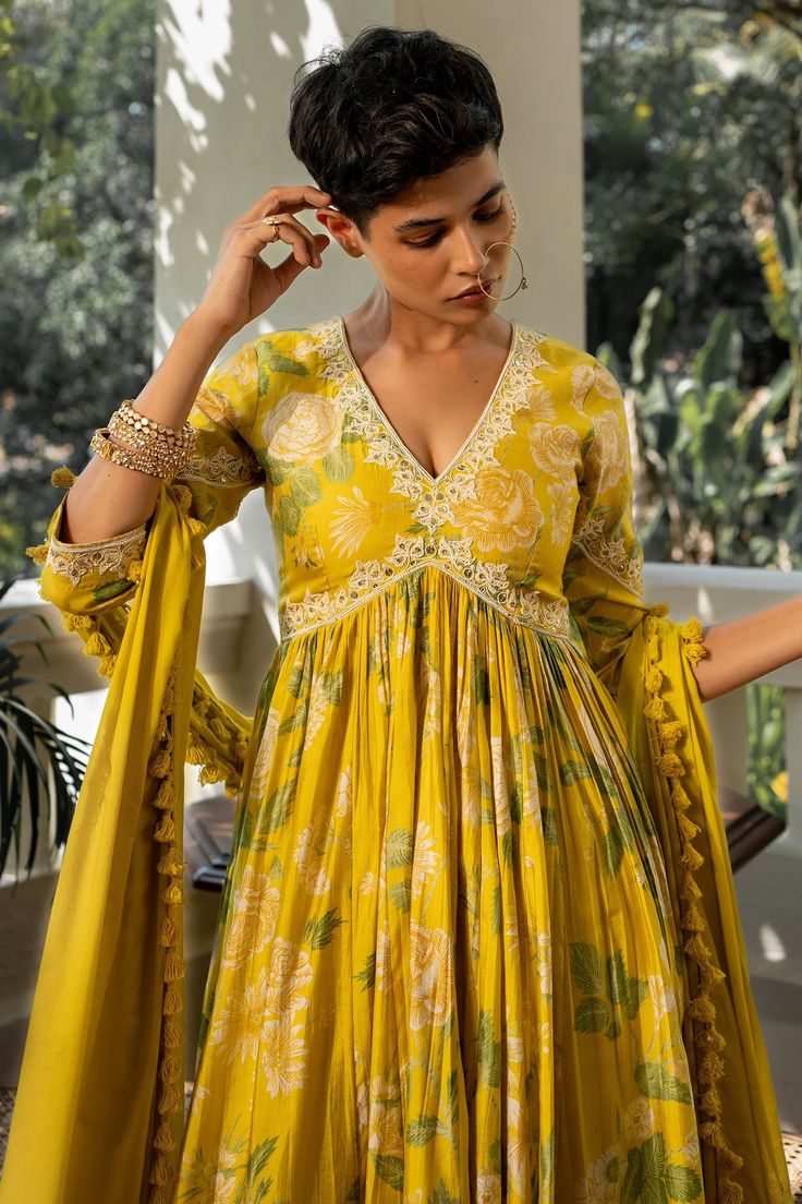 Yellow anarkali with garden of bloom floral patterns, ivory resham dori work with petal leaves motifs and sequins, moti and cutdana highlights with thread work buttas on sleeves and hand embroidery with dull gold accents. Comes with floral sprinkled dupatta and scallop detailed thread embroidered pant.
Components: 3
Pattern: Printed, Embroidered
Type Of Work: Floral Patterns, Sequins, Moti, Cutdana, Thread work
Neckline: V-Neck
Sleeve Type: Three Quarter Length
Fabric: Anarkali: Chiniya Silk, Pa Paulmi And Harsh, Anarkali Patterns, Yellow Anarkali, Anarkali Designs, Dori Work, Stylish Kurtis Design, Long Gown Design, Anarkali Dress Pattern, Yellow Garden