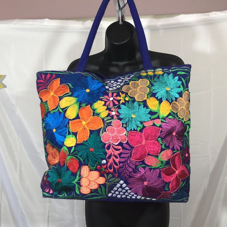 Multicolored Embroidered Handbag Great For Carrying Your Laptop Or Books. Blue Embroidered Bag For Daily Use, Embroidered Rectangular Beach Bag For Everyday Use, Rectangular Embroidered Beach Bag For Everyday Use, Embroidered Shoulder Beach Bag For Daily Use, Blue Embroidered Bag For Everyday Use, Blue Embroidered Bags For Everyday Use, Embroidered Blue Bag, Everyday Blue Embroidered Bags, Multicolor Bags With Embroidered Logo For Everyday Use