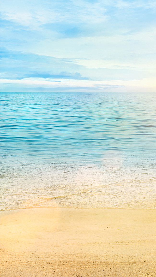 an empty beach with the ocean in the background