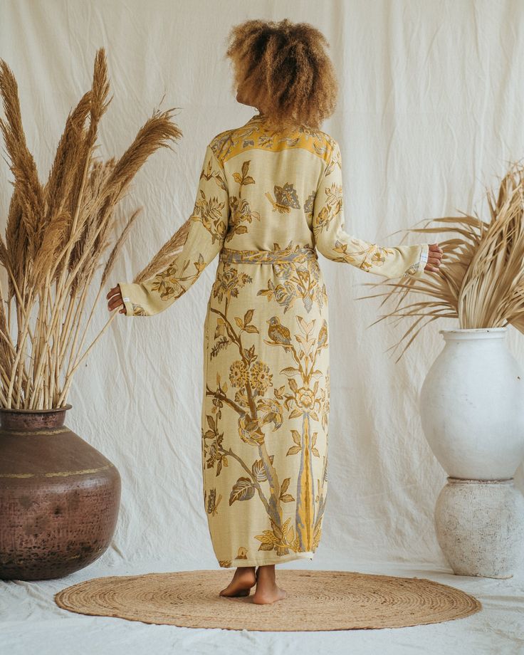 Presenting the Golden Lotus - Short Kimono, a unique piece from our slow fashion collection that's designed to radiate your confidence and individuality. This distinct piece is reversible, displaying meticulous craftsmanship and made-to-order for an opulent appearance that's sure to captivate attention. Size: Our model has the following measurements: Height: 172 cm | 5 ft 7 inches Chest: 88-94 cm | 35-37 inches She is wearing size M kimono with 85 cm | 33 inch length. Golden Lotus, Maxi Kaftan, Short Kimono, Slow Fashion, The Golden, Fashion Collection, Round Cut, Timeless Elegance, Unique Pieces