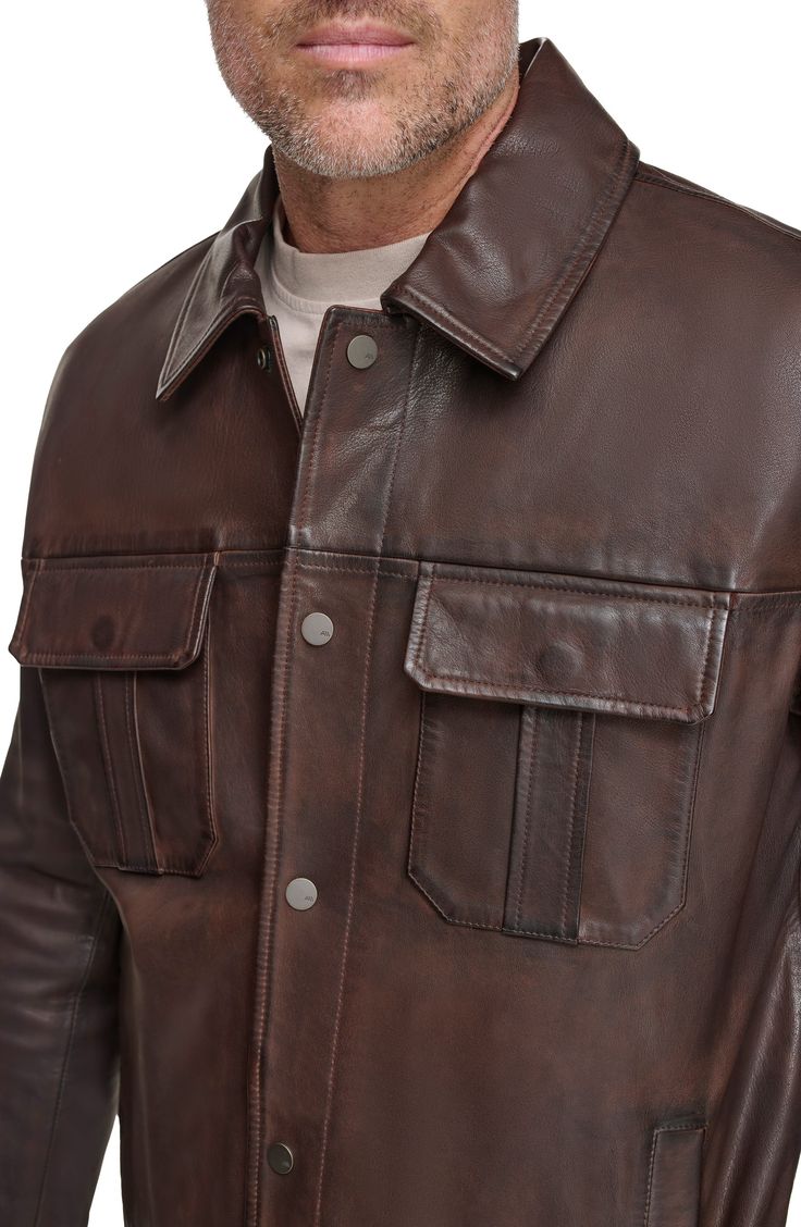 Workwear-inspired design defines a ruggedly handsome jacket built from fine lamb leather. 30" length Spread collar Leather Professional leather clean Imported Rugged Leather Outerwear, Rugged Leather Jacket With Button Closure, Rugged Collared Outerwear With Flap Pockets, Rugged Leather Jacket With Button Closure For Work, Rugged Outerwear With Double-needle Stitching, Rugged Long Sleeve Outerwear With Double-needle Stitching, Rugged Leather Biker Jacket With Pockets, Rugged Leather Jacket For Workwear, Rugged Leather Jacket With Long Sleeves For Work