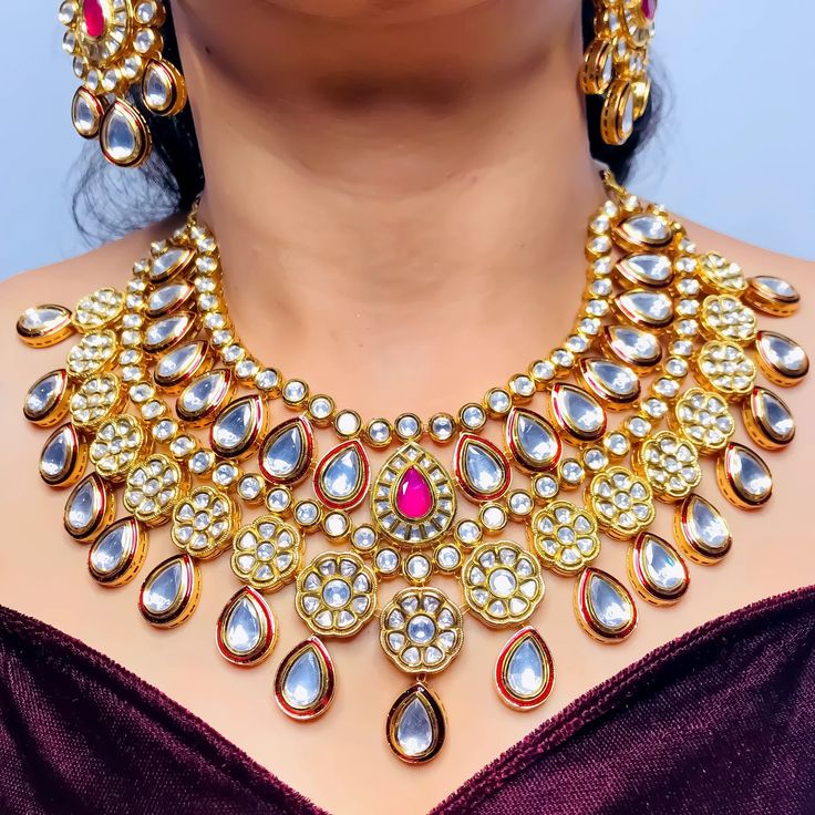 Exotic and snag-free kundan beaded necklace set with earrings. This is a stylish set with White Kundan. This set will work well with traditional, formal, and western formals. Option 1: White Color (D765) Option 2: Red Color (D766) Eye-catching and unique jewelry that will set you apart. Gift this piece to a loved one, and see their face light up with joy. Best for gifting or for personal use, wear it to any occasion and become the spotlight. Festive Dual-tone Kundan Jewelry Sets, Dual-tone Kundan Chandbali Bridal Necklace, Dual-tone Chandbali Kundan Bridal Necklace, Festive Dual-tone Kundan Bridal Necklace, Elegant Dual-tone Kundan Necklace, Festive Dual-tone Kundan Necklace For Celebration, Bollywood Style Dual-tone Festive Jewelry Sets, Dual-tone Kundan Chandbali Necklace For Wedding, Dual-tone Chandbali Kundan Necklace For Wedding