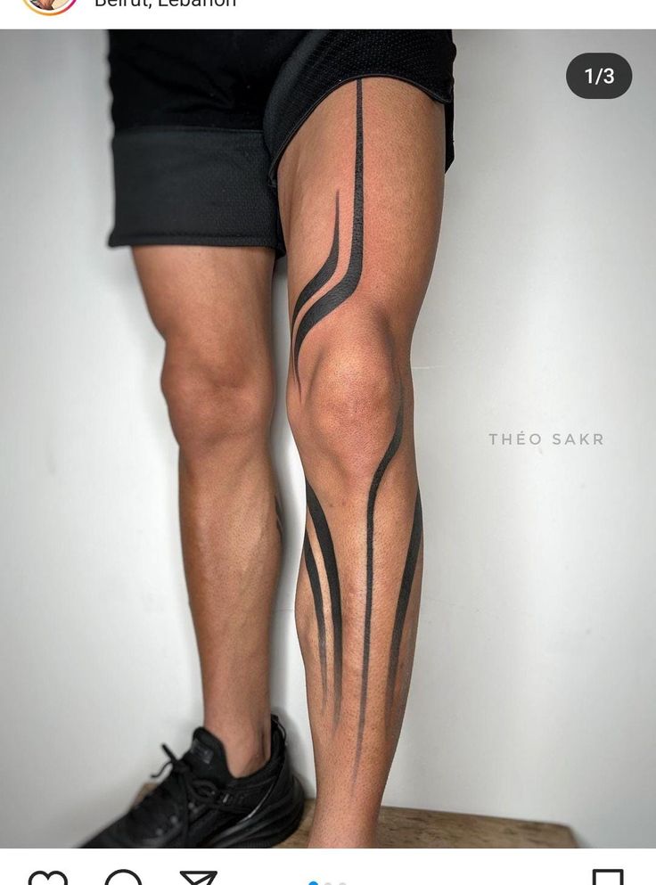 a man's legs with black lines on them