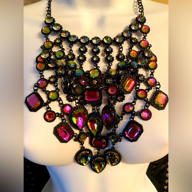 Brand New, Statement Necklace,Bib Style Necklace Adorned With Aurora Borealis Stones In Many Shapes And Size, Adjustable Chain To Allow For Different Necklines. Multicolor Metal Jewelry For Party, Multicolor Metal Party Jewelry, Multicolor Metal Rhinestone Necklace For Party, Bohemian Purple Necklaces For Parties, Bohemian Purple Necklace For Party, Party Multicolor Rhinestone Necklace, Purple Party Jewelry, Multicolor Crystal Necklaces For Parties, Multicolor Jeweled Necklaces For Party