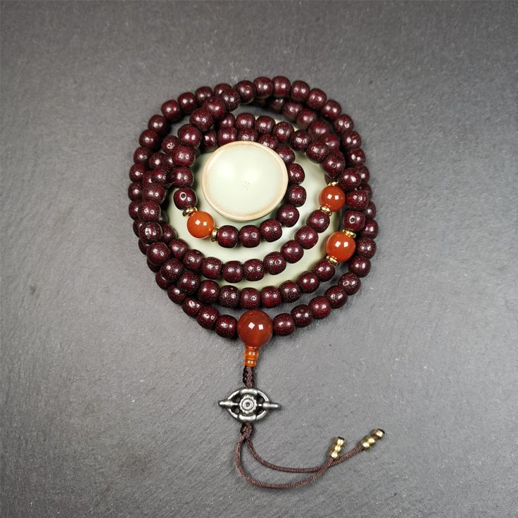 ❤This mala is made by Tibetan craftsmen and come from Hepo Town, Baiyu County,Tibet, the birthplace of the famous Tibetan handicrafts.It's composed of 108 pcs 9mm lotus seed beads,with agate spacer beads,and agate bead counters,diameter 0.35",circumference 35".❤Details:Mala'perimeter is 88cm,35 inches.108 lutus seed beads approximately 9mm / 0.35 inch.1 × agate main bead,diameter 12mm × 10mm / 0.47 × 0.4 inch.2 × agate spacer beads diameter 10mm / 0.4 inch.1 × agate guru bead,22mm × 13mm / 0.87 Traditional Jewelry For Meditation With 8mm Beads, Traditional 8mm Beads Jewelry For Meditation, Traditional Jewelry With 8mm Beads For Meditation, Traditional Handmade Beaded Bracelets For Meditation, Traditional Beaded Bracelets For Meditation With 108 Beads, Handmade Spiritual Mala With Oval Beads, Bohemian 108 Beads Round Mala, Bohemian Mala With 108 Round Beads, Bohemian Mala With 108 Beads