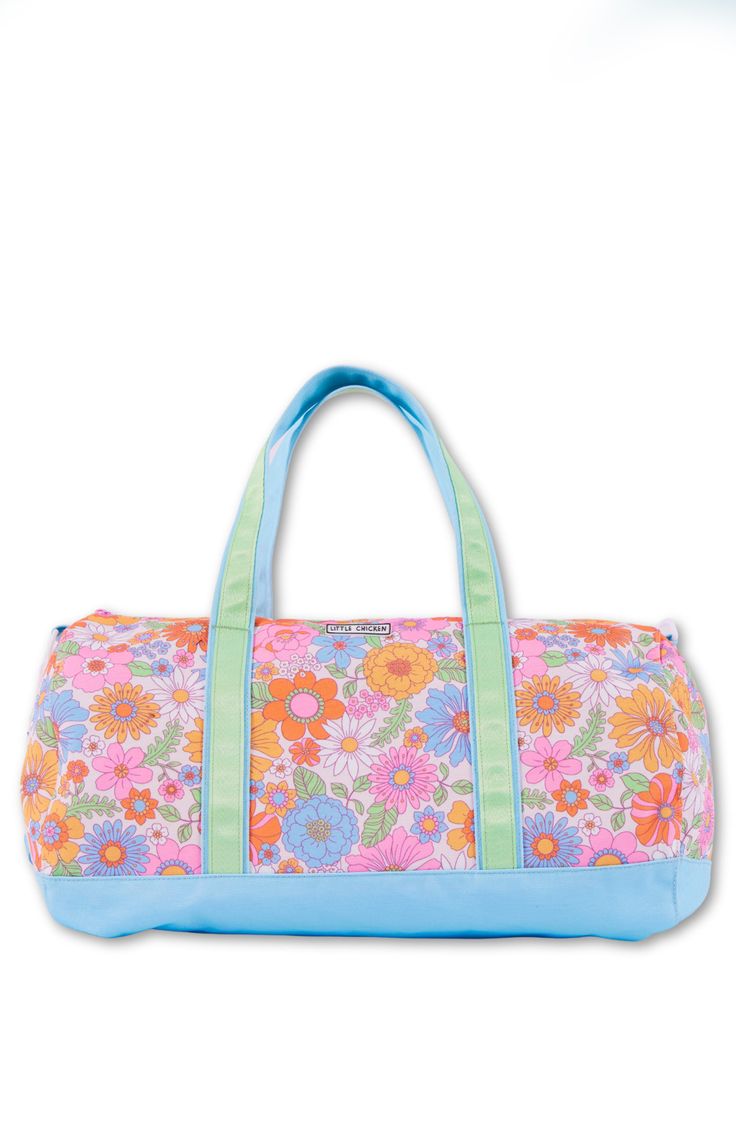 This roomy floral duffle bag  is the perfect bag for sleepovers or vacations and features adjustable straps. Spot Clean Top zip closure Top carry handles Interrior Zip Pocket Made of durable polycanvas Lined in nylon 18" X 10.5" Casual Pink Duffle Bag For Weekend, Pink Casual Weekender Bag, Casual Pink Weekender Bag, Casual Multicolor Travel Bag For Overnight Trips, Casual Multicolor Bag For Overnight Trips, Adjustable Cotton Travel Bags, Summer Camp Essentials, Custom Duffle Bags, Summer Camp Outfits