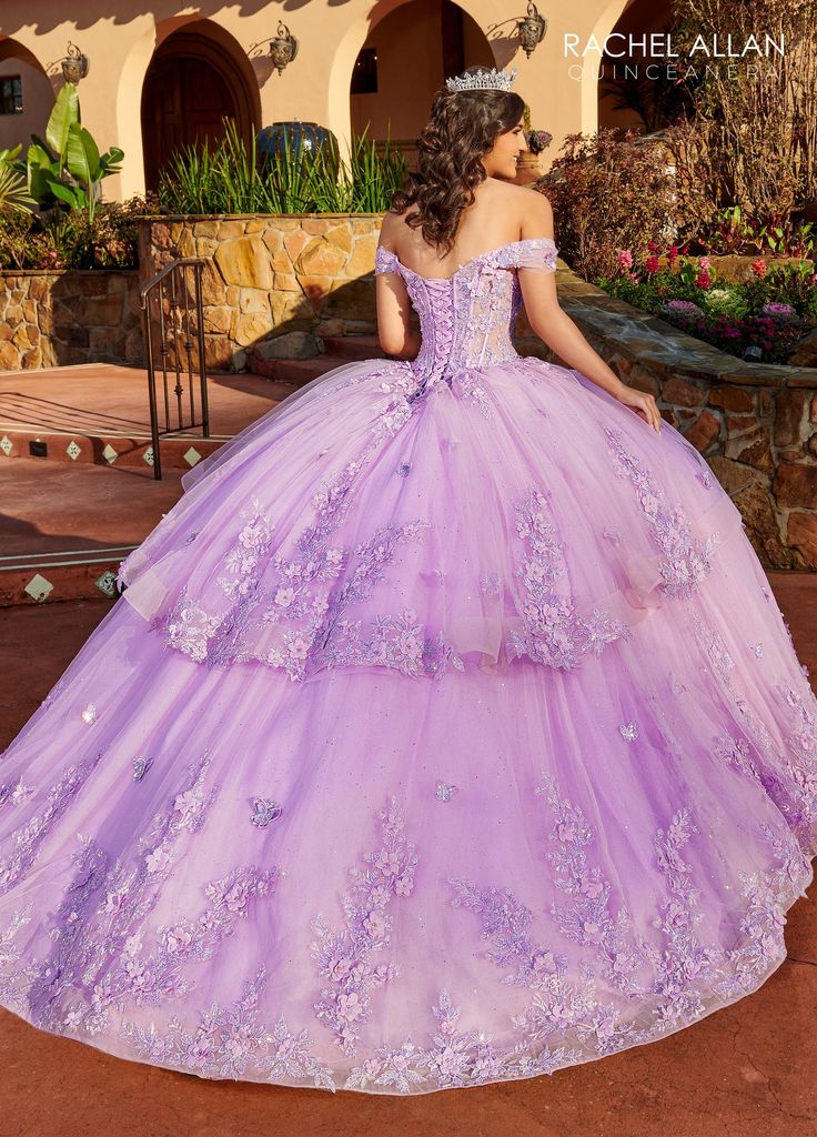 Look timeless in this 3D floral applique long off the shoulder corset dress with A-line skirt by Rachel Allan RQ2179. Off-the-shoulder glitter tulle quinceanera ball gown with a sweetheart corset bodice, detachable bodice liner, 2-tier skirt, and sweep train. The dress is embellished with lace applique, 3D flowers, and beads. Off Shoulder Corset Quinceanera Dress by Rachel Allan RQ2179 Rachel Allan La Reina Collection: Fall 2023 Style Number: RQ2179 Fabric: Tulle, Glitter Tulle, Beading, 3D Flow Quinceanera Purple Dresses, Quinceanera Dresses Off The Shoulder, Lilac Quinceanera Dresses, Purple Quinceanera Dresses, Purple Quince, Quinceñera Dresses, Dresses Off The Shoulder, Sweet 16 Party, Pretty Quinceanera Dresses