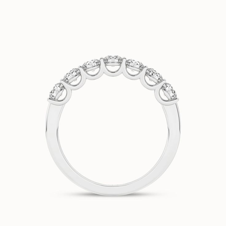 The 7-Stone Keepsake Vows ring is a beautiful representation of love and commitment. With seven round diamonds set in a stunning gold/platinum band, this ring captures the essence of everlasting love. Its exquisite design and flawless craftsmanship make it a cherished piece for a lifetime. Brilliant Round Cut Eternity Band For Promise, Brilliant Cut Eternity Band For Promise, Classic Diamond Stackable Rings With Round Band, Stackable Rings With Single Cut Diamonds, Stackable Brilliant Cut Round Band Rings, Classic Stackable Rings With Prong Setting, Classic White Eternity Band For Promise, Half Eternity Lab-grown Diamond Round Cut Ring For Wedding, Timeless Wedding Diamond Ring With Round Band