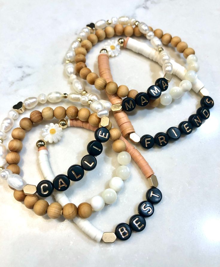 "Adorable mama+mini best friends boho bracelet set with daisy bead. This is a beautiful combination of neutral colors, pearls, gold, and heishi beads. Perfect gift for everyone!  Sizing Recommendation:  I recommend measuring your wrist and ordering 1/2\" larger than your measurement. If ordering as a gift, the most common size is 7\" for adult and 6\" for child." Personalized Bohemian Gold Friendship Bracelets, Adjustable Letter Beads Friendship Jewelry, Bohemian Jewelry With Letter Beads For Friendship, Bohemian Style Jewelry With Letter Beads For Friendship, Everyday Beaded Bracelets For Mother's Day, Personalized Bohemian Friendship Bracelets For Gifts, Adjustable Beaded Bracelets For Best Friend Gift, Trendy Beaded Bracelets For Best Friend Gift, Bohemian Letter Beads Bracelets For Mother's Day