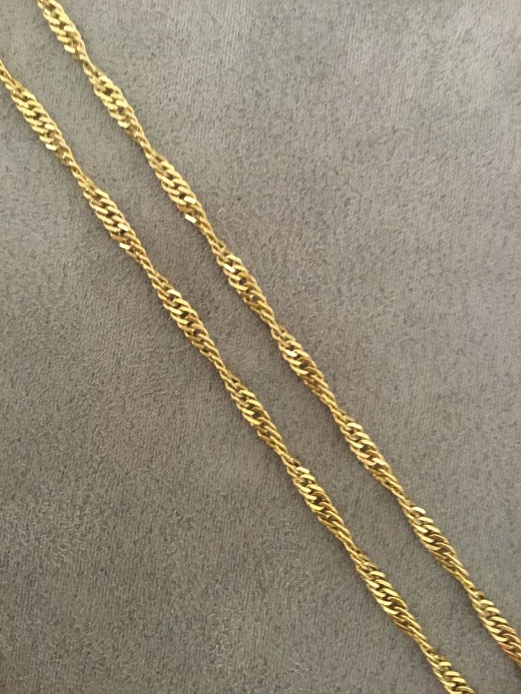 Solid twisted gold curb linked chain. This 18 inch long chain has a double link with a twisted link and is secured with a strong lobster catch. Made in London, England in the 1990's from 9k yellow gold. The chain is in very good condition. Gold Plated Cuban Link Rope Chain Necklace, Elegant Gold Figaro Rope Chain Necklace, Rope Chain Necklace With Curb Chain For Gift, Elegant Cuban Link Rope Chain Necklace, Elegant Yellow Gold Rope Chain Necklace With Curb Detail, Gift Rope Chain Necklace With Curb Link, Formal Gold Rope Chain Link Necklace, Elegant Yellow Gold Curb Chain Necklace, Gold Twisted Rope Chain Necklace