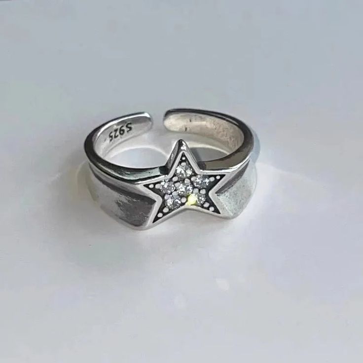 Delight in the star-shaped design of our Y2K Adjustable Rings! Crafted with Cubic Zirconia and Zinc alloy, these rings will have you looking stellar. DETAILSPattern Type: StarMaterial: Cubic ZirconiaMetals Type: Zinc alloy Egirl Jewelry, Star Couple, Outfit Upgrade, Y2k Accessories, Y2k Jewelry, Gothic Rings, Trendy Ring, Five Pointed Star, Vintage Punk